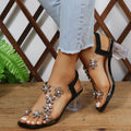 Damen Elegante Sandalen mit Blumenapplikationen und transparentem Absatz Selmira