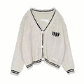 Damen nan kurz geschnittene Strickjacke mit V-Ausschnitt, Kontrastpaspel und oversized Ärmeln