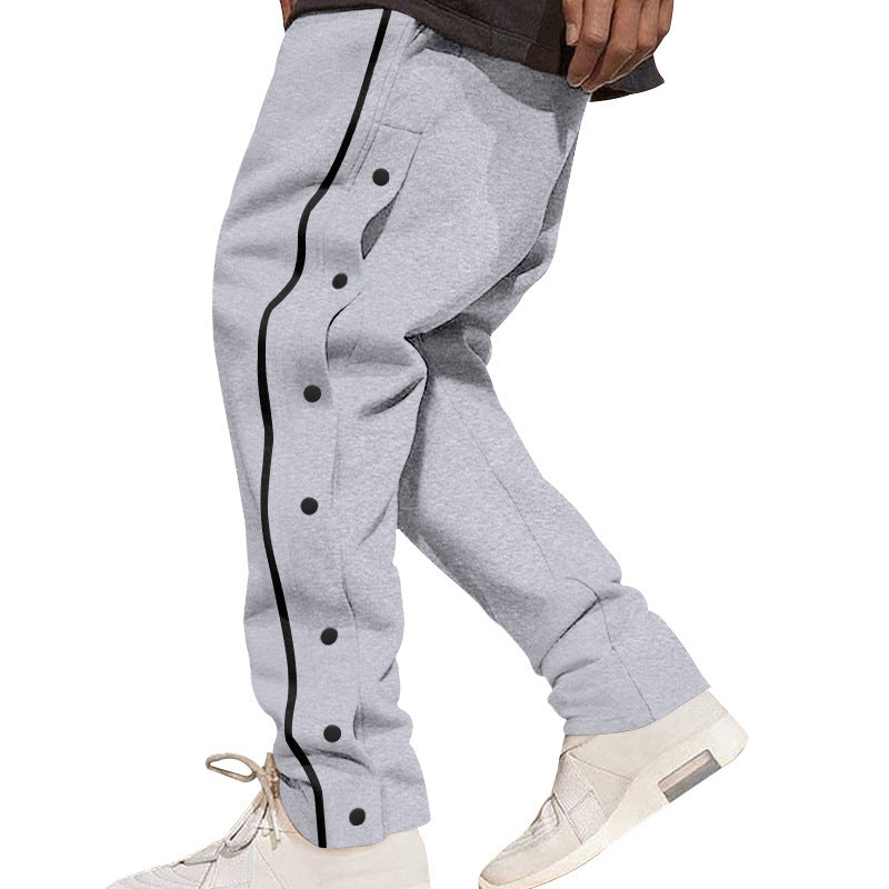 Herren nan weite Trackpants mit seitlicher Druckknopfleiste, elastischem Bund und reflektierendem Streamline-Streifen
