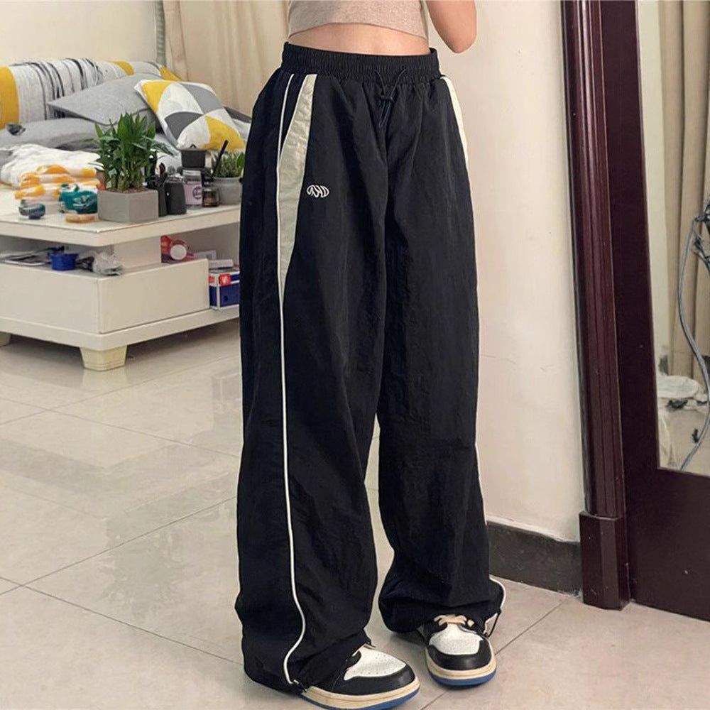 Damen nan weite Trackhose mit Kontrastpaspel, elastischem Bund und Oversize-Schnitt