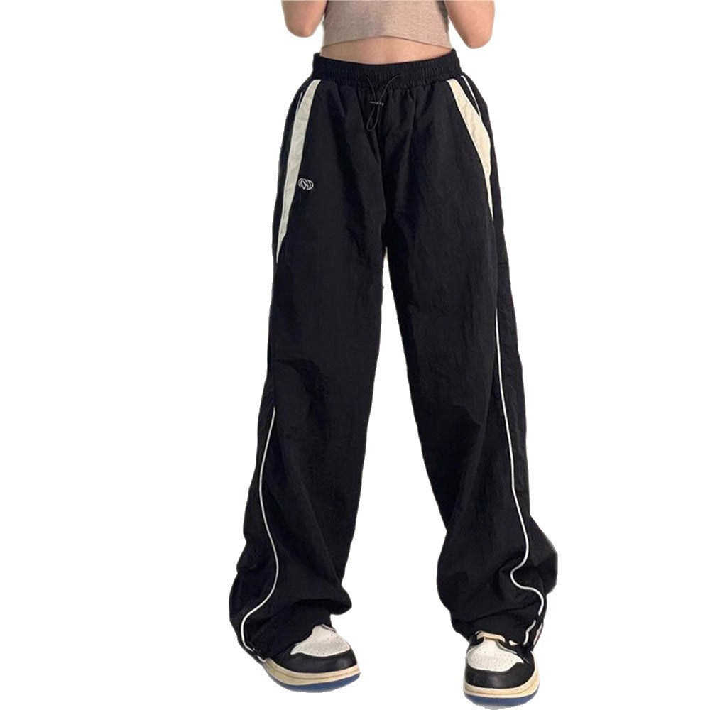 Damen nan weite Trackhose mit Kontrastpaspel, elastischem Bund und Oversize-Schnitt