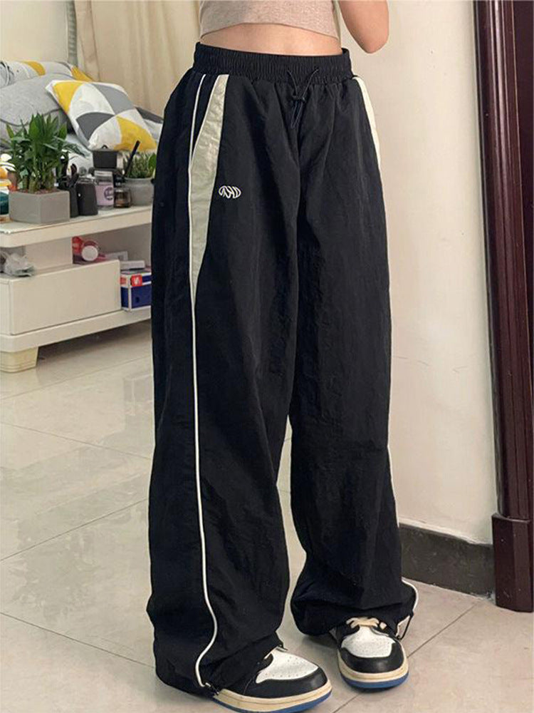 Damen nan weite Trackhose mit Kontrastpaspel, elastischem Bund und Oversize-Schnitt