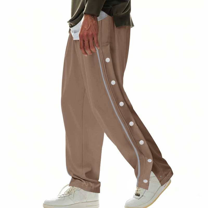 Herren nan weite Trackpants mit seitlicher Druckknopfleiste, elastischem Bund und reflektierendem Streamline-Streifen