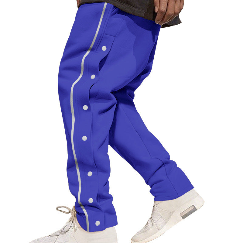 Herren nan weite Trackpants mit seitlicher Druckknopfleiste, elastischem Bund und reflektierendem Streamline-Streifen